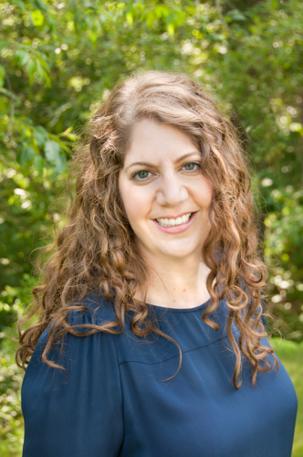 Photo of Tsoleen Sarian. She has brown hair and light complexion skin and is wearing a blue shirt.